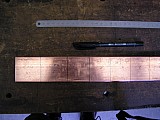 012 Kupferstange 50x10 angerissen Ausschnitt.jpg